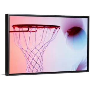 "Blurred view of basketball going into hoop" Black Float Frame Canvas Art