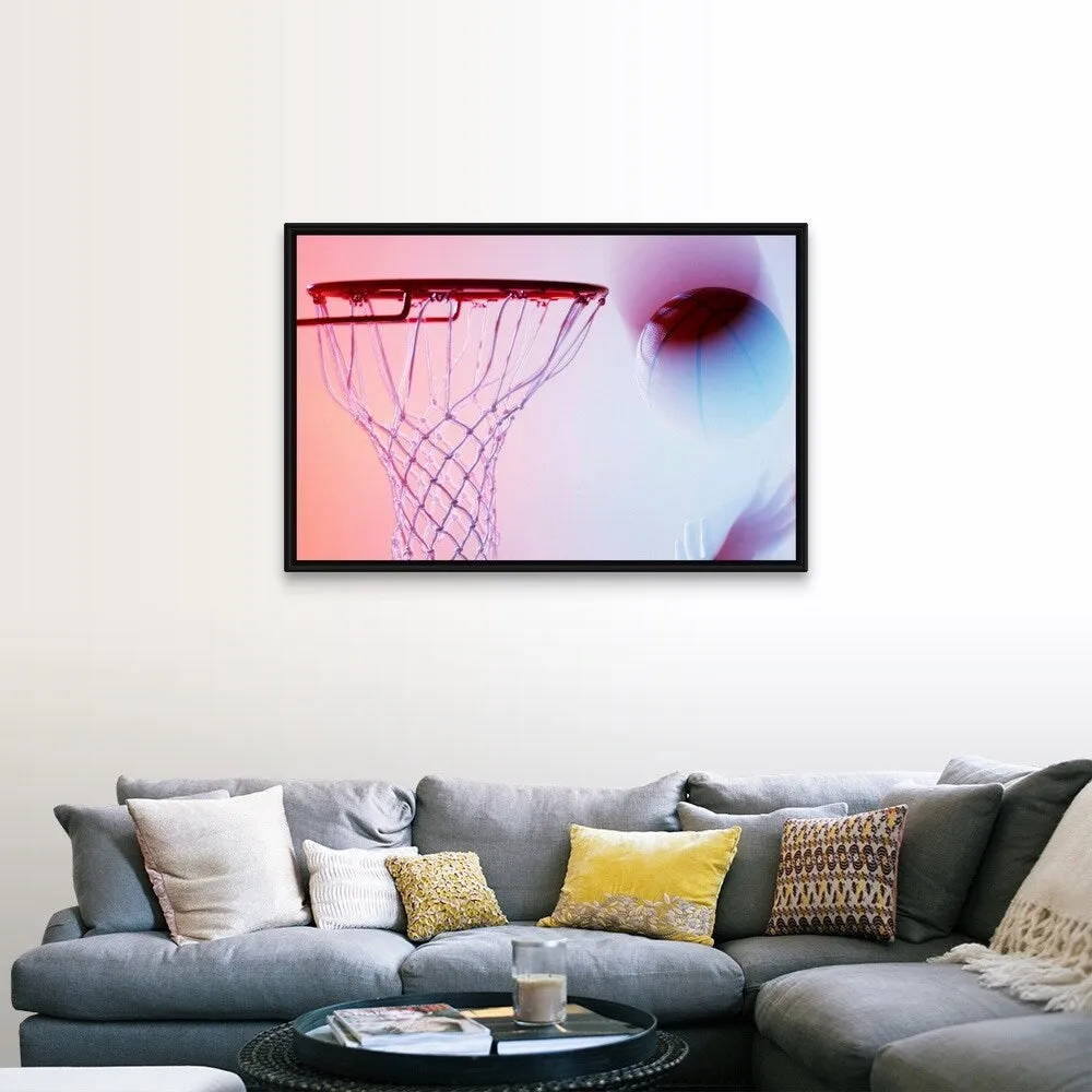 "Blurred view of basketball going into hoop" Black Float Frame Canvas Art